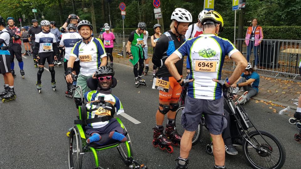 Man in wheelchair smiling at the camera