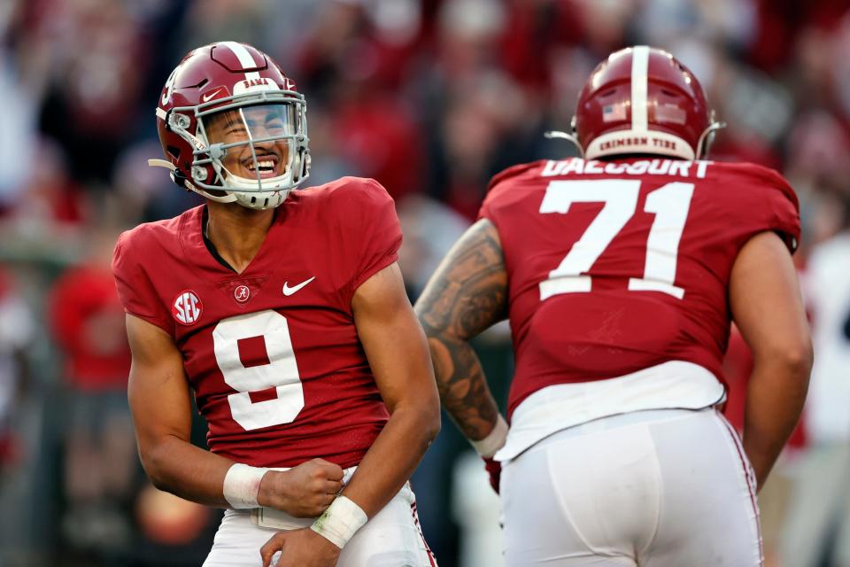 Alabama Crimson Tide quarterback Bryce Young (9) reacts after throwing a pass for a touchdown against the Arkansas Razorbacks during the first half at Bryant-Denny Stadium.