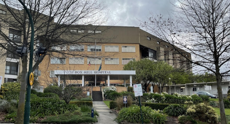 Box Hill Hospita in Melbourne. Brown brick building with trees out the front.