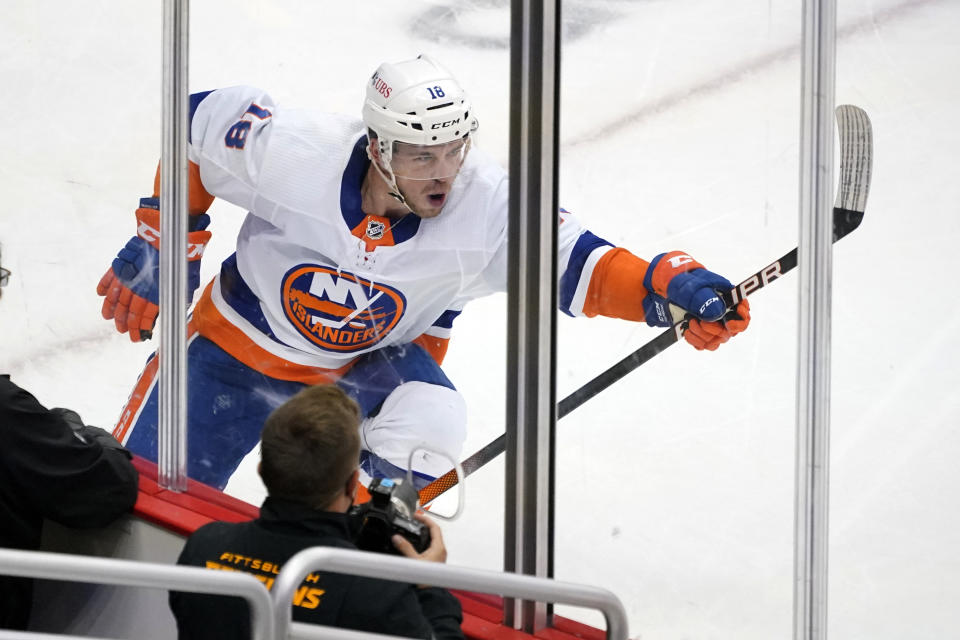 New York Islanders' Anthony Beauvillier celebrates after scoring during the first period in Game 5 of an NHL hockey Stanley Cup first-round playoff series against the Pittsburgh Penguins in Pittsburgh, Monday, May 24, 2021. (AP Photo/Gene J. Puskar)