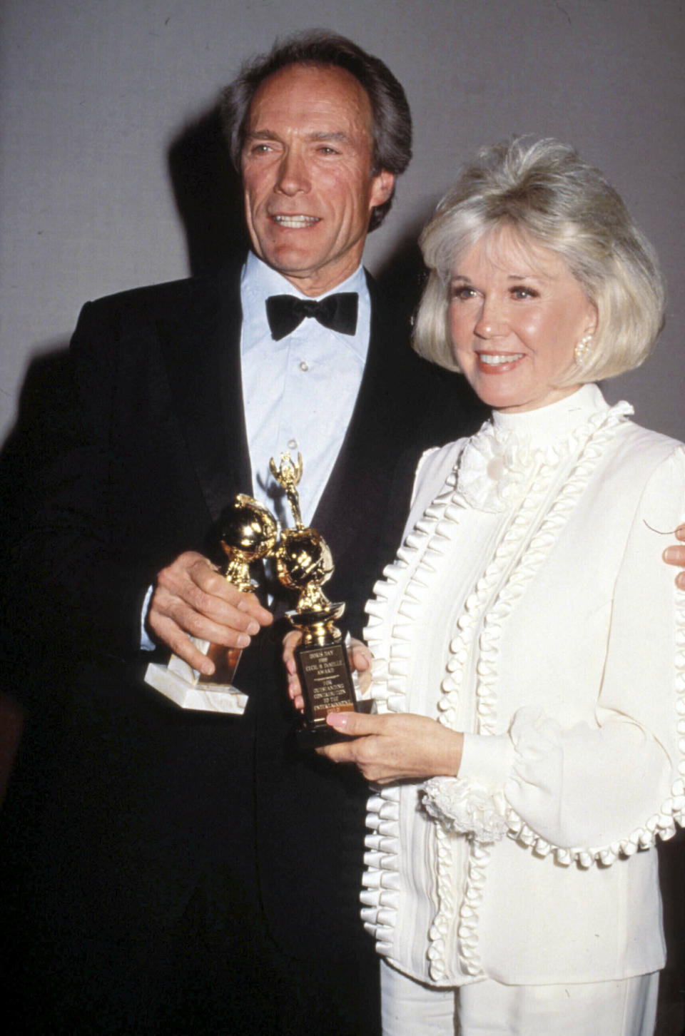 ***FILE PHOTO*** Doris Day has passed Away - 1922-2019. Clint Eastwood and Doris Day at the 1989 Golden Globe Awards Credit: 1688499Globe Photos/MediaPunch /IPX