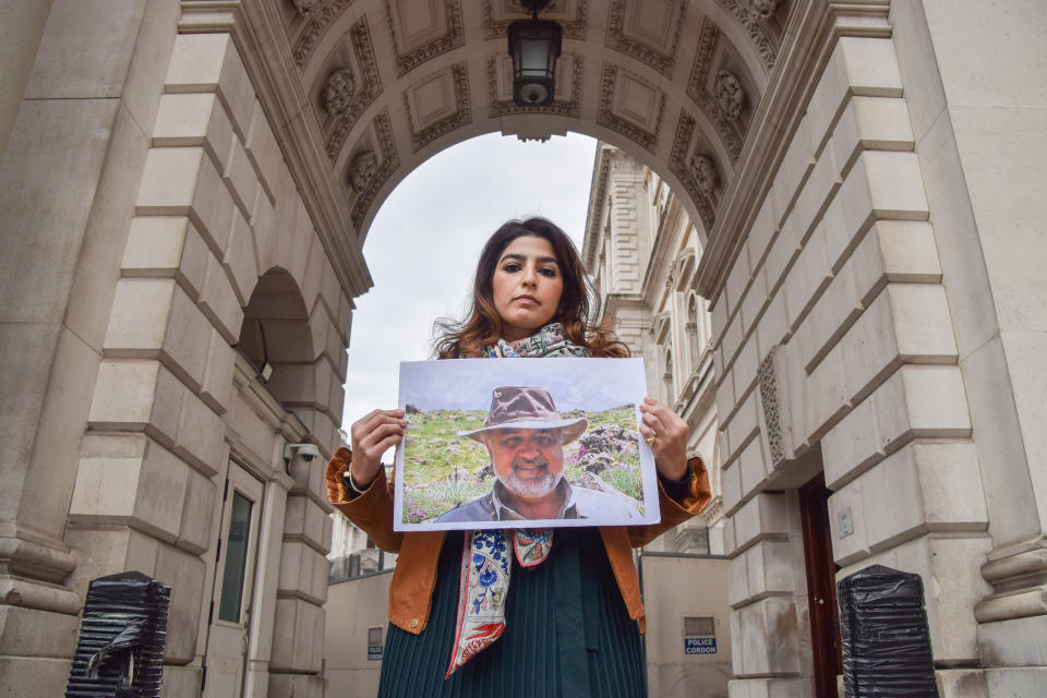 Roxanne Tahbaz holds a picture of her father Morad Tahbaz in London (Vuk Valcic / SOPA Images/LightRocket via Getty Images file)