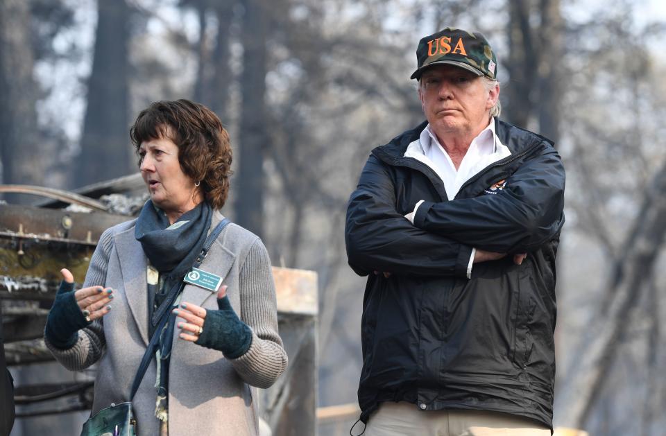 President Trump views damage caused by wildfires as a city council member speaks in Paradise, Calif., on Nov. 17, 2018. (Photo: Saul Loeb/AFP/Getty Images)