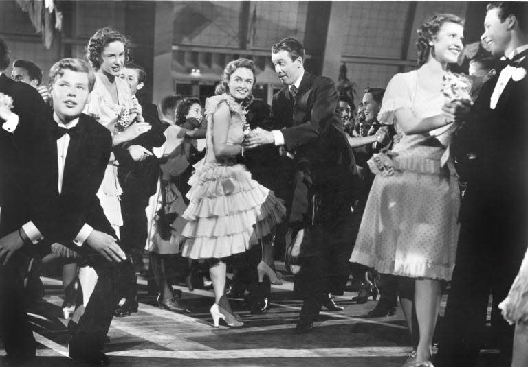 Donna Reed, center left, and Jimmy Stewart, center right, in the famous dance scene (watch out for that retractable floor) in "It's a Wonderful Life."