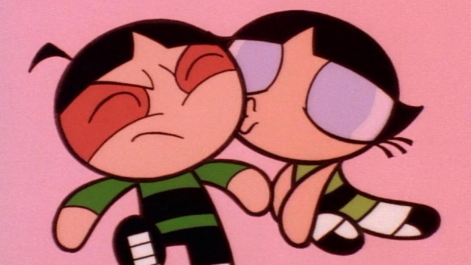 Powerpuff Girl Blossom kisses her black-haired Rowdyruff Boy counterpart.