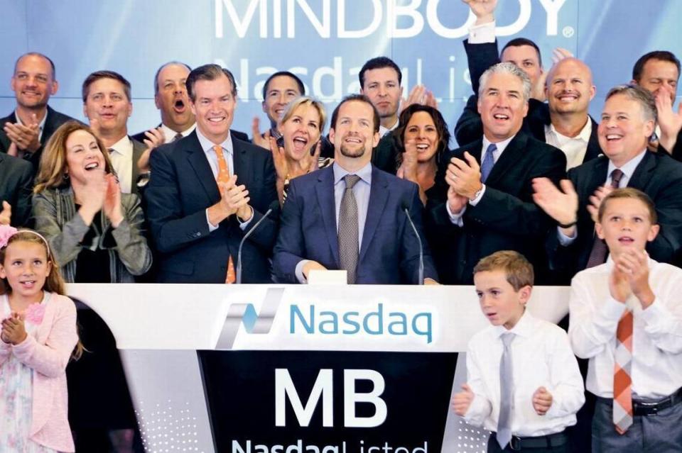 MindBody CEO Rick Stollmeyer rings the bell at the Nasdaq exchange on the first day of trading for his company’s stock after it went public in 2015.