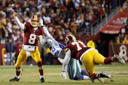 Washington Redskins quarterback Kirk Cousins (8) throws the ball as Dallas Cowboys defensive end Demarcus Lawrence (90) defends in the third quarter at FedEx Field. The Cowboys won 19-16. Mandatory Credit: Geoff Burke-USA TODAY Sports