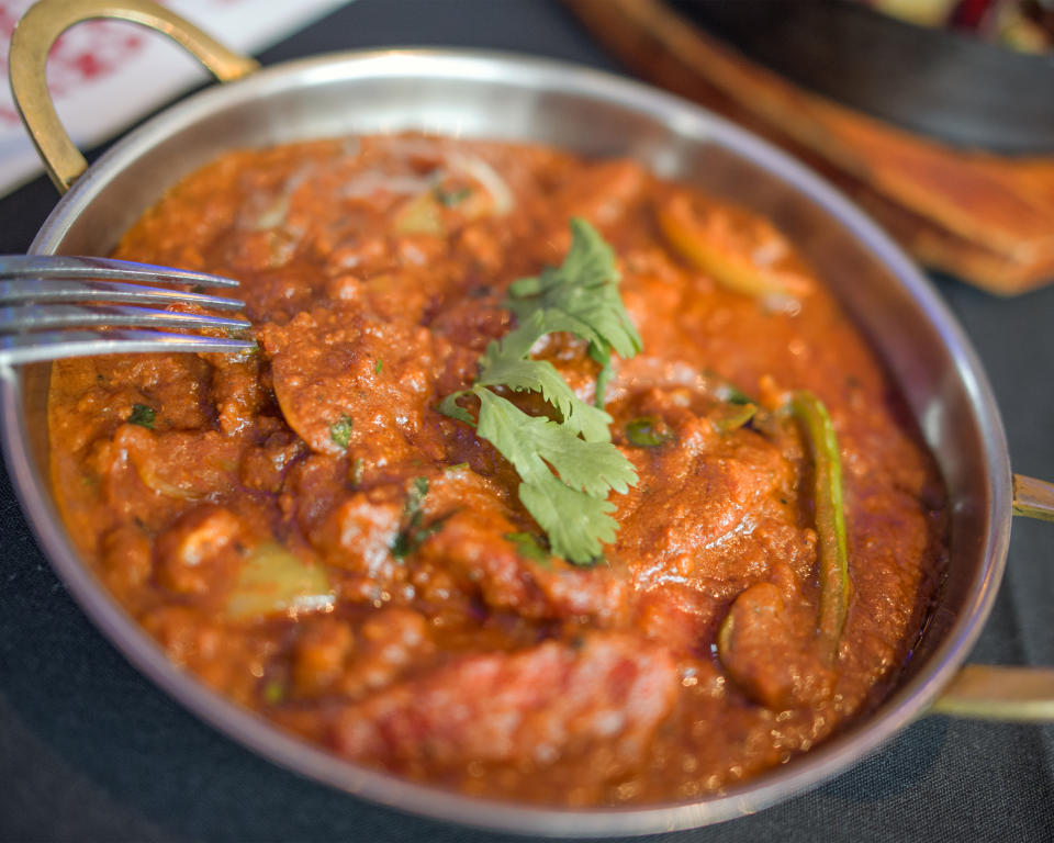 dad against son eating Indian curry (pictured) 