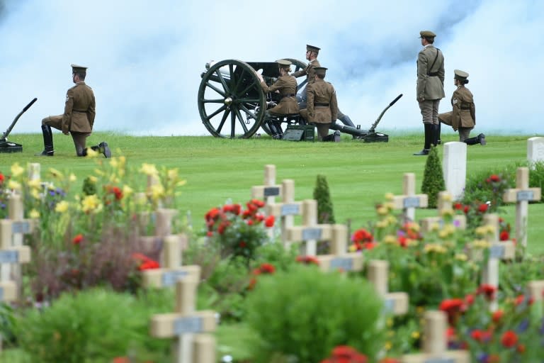 Men dressed as World War I (WWI) soldiers load a cannon as they commemorate the anniversary of the Battle of the Somme in Thiepval, northern France, on July 1, 2016