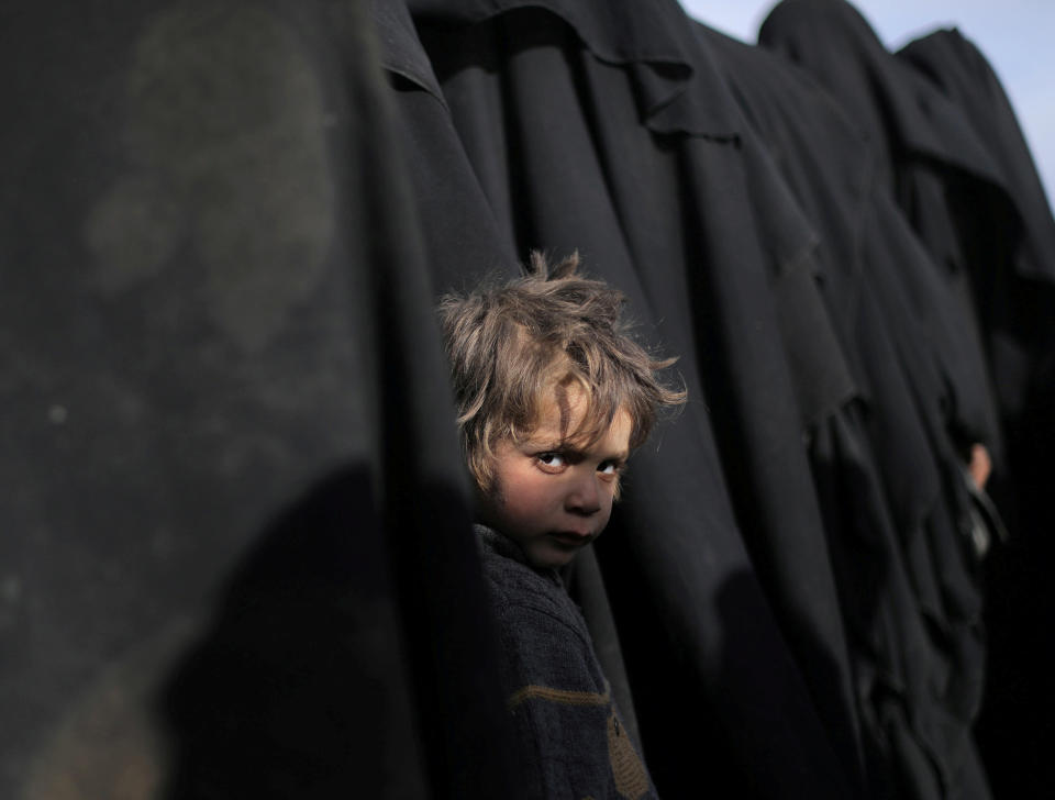 A boy looks at the camera near Baghouz, Deir Al Zor province, Syria on March 5, 2019. (Photo: Rodi Said/Reuters)