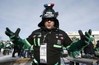 A Saskatchewan Roughriders fan arrives in costume for the CFL's 101st Grey Cup championship football game in Regina, Saskatchewan November 24, 2013. REUTERS/Mark Blinch (CANADA - Tags: SPORT FOOTBALL)