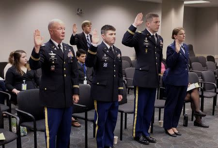 Army Col. Neil Page (L) and medical students who were identified as patient C, patient A and individual 2 (L to R) prepare to testify before the Virginia Board of Medicine regarding the medical practices of Dr John Henry Hagmann, in Richmond, Virginia June 19, 2015. REUTERS/Jay Paul