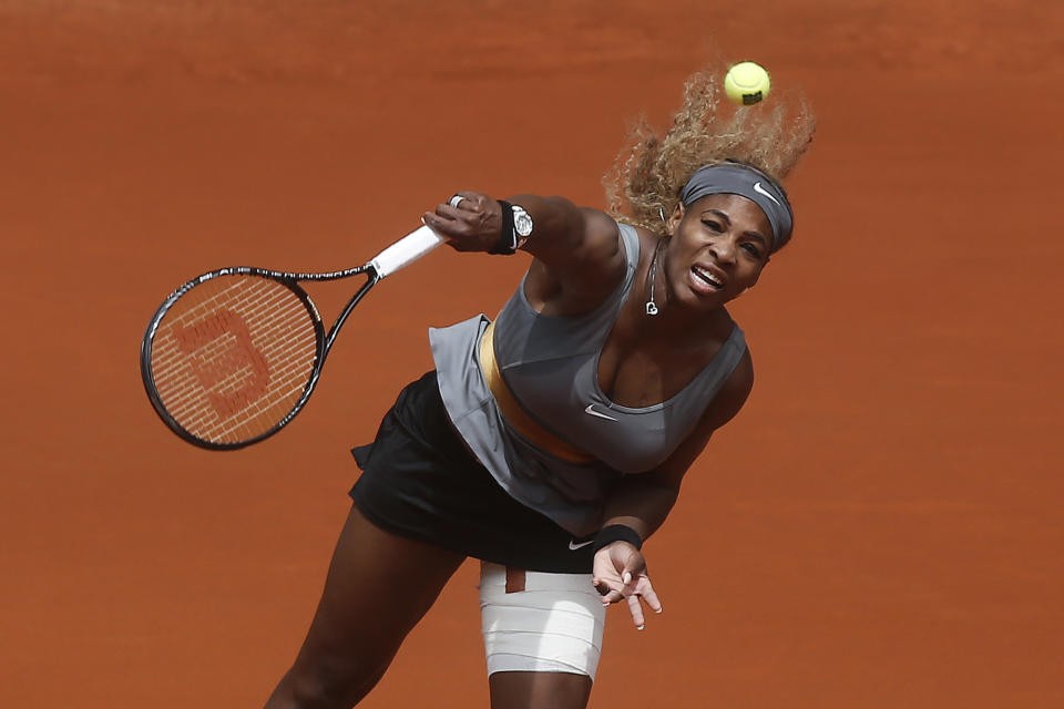 Serena Williams from US serves during a Madrid Open tennis tournament match against Shuai Peng from China, in Madrid, Spain, Wednesday, May 7, 2014. (AP Photo/Andres Kudacki)