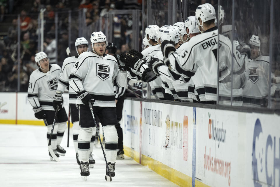 Los Angeles Kings right wing Arthur Kaliyev (34) celebrates his goal with the bench during the first period of an NHL hockey game against the Anaheim Ducks, Friday, Nov. 24, 2023, in Anaheim, Calif.. (AP Photo/Kyusung Gong)