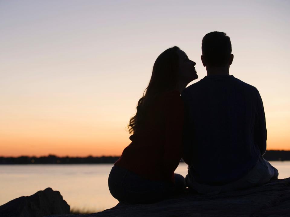 a couple's silhouette during the sunset