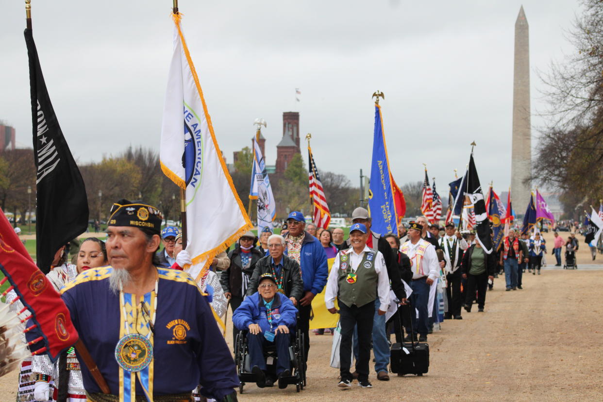 Native veterans march to the National Native American Veterans Memorial at the National Museum of the American Indian on the National Mall in Washington, D.C. on Friday, Nov. 11, 2022 (Photo/Darren Thompson)