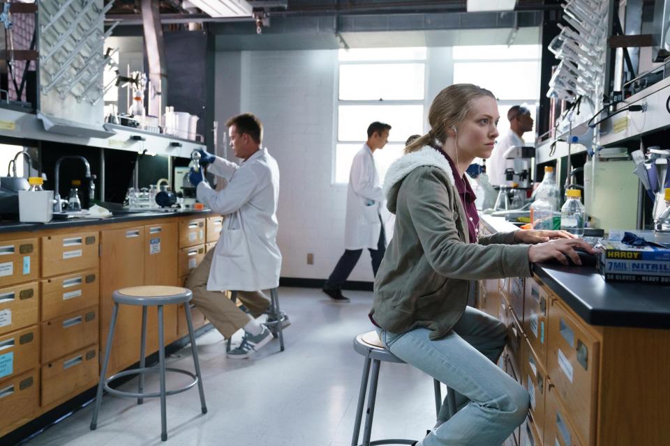 Amanda sits in a science lab to do some work