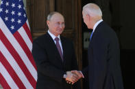 Russian President Vladimir Putin, left, and U.S President Joe Biden shake hands during their meeting at the 'Villa la Grange' in Geneva, Switzerland in Geneva, Switzerland, Wednesday, June 16, 2021. (AP Photo/Alexander Zemlianichenko, Pool)