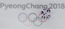 <p>The South Korea team reacts after winning the women’s 3,000m relay short track speed skating heat event during at the Gangneung Ice Arena in Gangneung on February 10, 2018. </p>