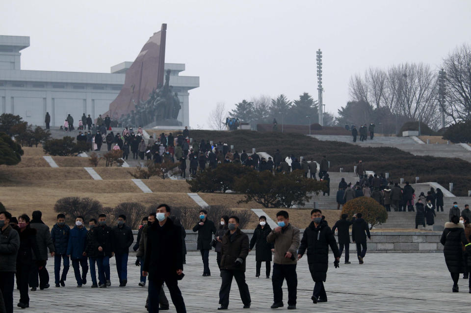 Citizens visit the bronze statues of their late leaders Kim Il Sung and Kim Jong Il on Mansu Hill in Pyongyang, North Korea Thursday, Dec. 16, 2021, on the occasion of 10th anniversary of demise of Kim Jong Il. (AP Photo/Jon Chol Jin)