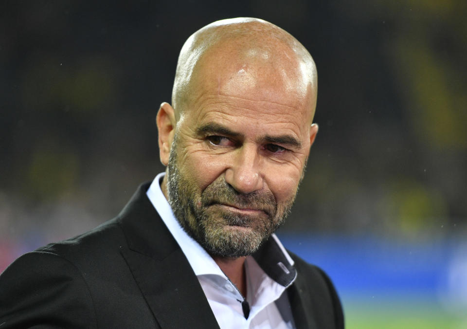 FILE - In this Saturday, Nov. 4, 2017 file photo Dortmund's then coach Peter Bosz is pictured prior the German Bundesliga soccer match between Borussia Dortmund and FC Bayern Munich in Dortmund, Germany. German Bundesliga soccer club Bayer 04 Leverkusen has introduced Bosz as the new headcoch and successor of coach Heiko Herrlich who was dismissed on Sunday. (AP Photo/Martin Meissner, file)