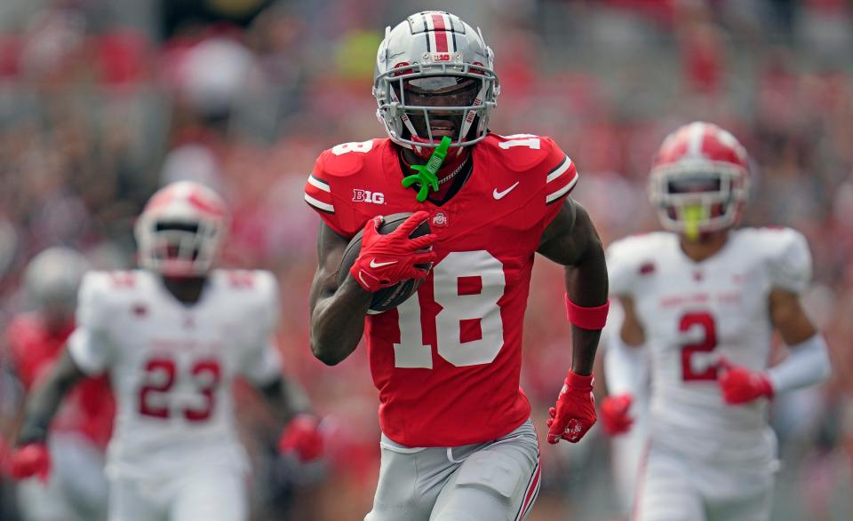 Sep 09, 2023; Columbus, OH, USA; Ohio State Buckeyes wide receiver Marvin Harrison Jr. (18) runs in a touchdown in the first quarter of their NCAA football game against Youngstown State.