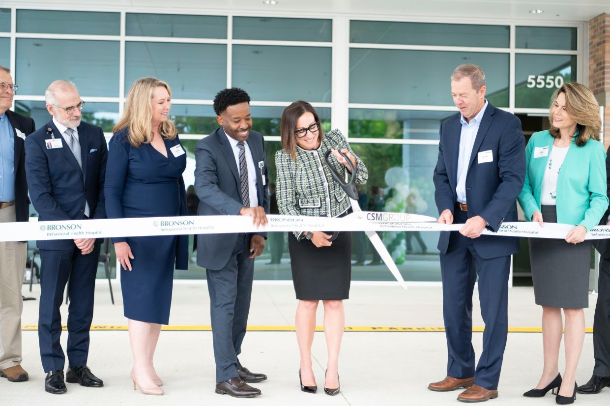 Bronson Chief Operating Officer Joseph du Lac, Michigan Health and Hospital Association Government Relations and Public Policy Executive Vice President Laura Appel, Bronson President and CEO Bill Manns, Bronson Behavioral Health Hospital CEO Deb Rozewicz, Acadia Executive Vice President John Hollinsworth and Acadia Senior Vice President Isa Diaz cut the ribbon at Bronson Behavioral Health Hospital in Battle Creek on Thursday, June 15, 2023.