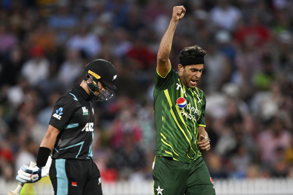 Pakistan bowler Abbas Afridi, right, celebrates the wicket of Mark Chapman during the T20 cricket international between New Zealand and Pakistan at Eden Park in Auckland, New Zealand, Sunday, Jan. 14, 2024. (Andrew Cornaga/Photosport via AP)