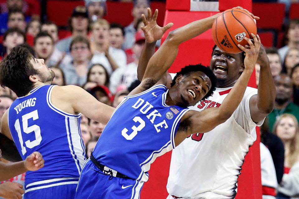 Duke's Jeremy Roach (3) tries to pull in the ball in front of North Carolina State's D.J. Burns Jr. during the first half of an NCAA college basketball game in Raleigh, N.C., Wednesday, Jan. 4, 2023. (AP Photo/Karl B DeBlaker)