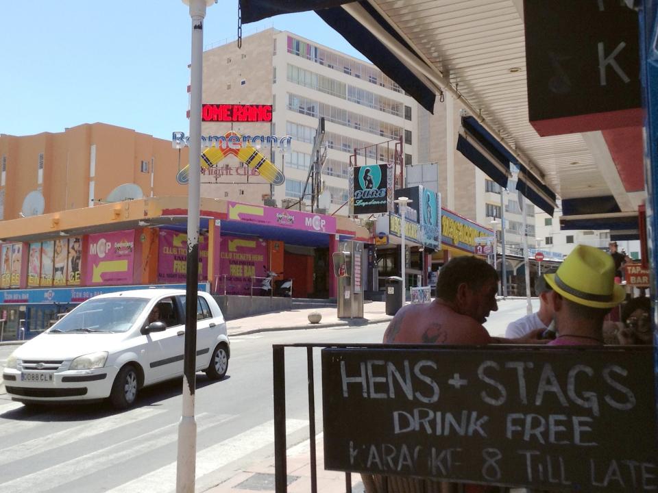 Tourists sit in a restaurant located on the street Puerto Ballena in Magaluf, Mallorca.