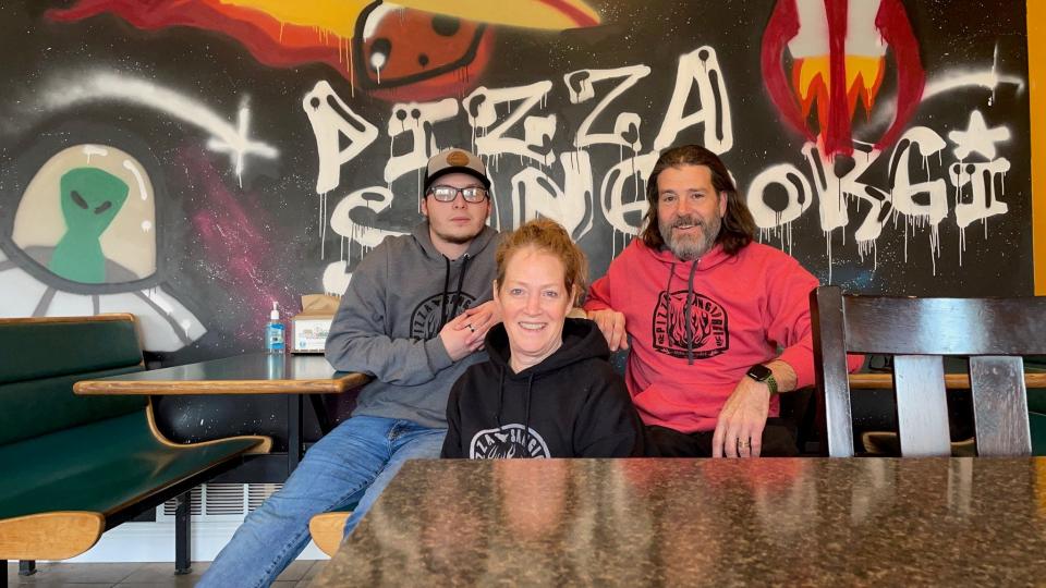 From left, store employee Patrick Hampton, with Ann Marie and Chuck St. George, are seen at St. George’s Grocery & Deli and Pizza Sangiorgi in Gorham. Ann and Chuck were instrumental in collecting enough signatures on a petition to bring a public vote on whether the town will allow marijuana retail sales and lounges.