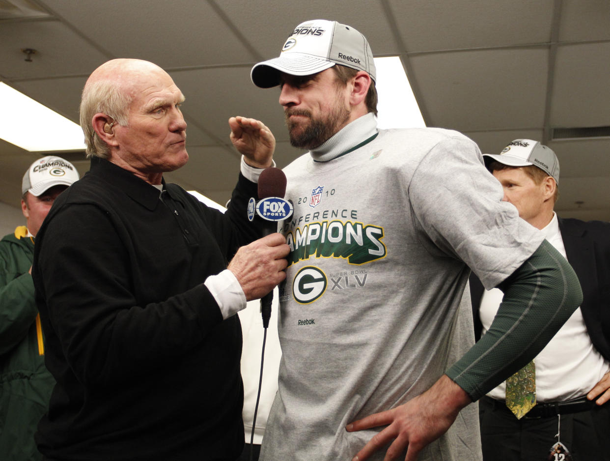 Green Bay Packers' Aaron Rodgers with Terry Bradshaw after the NFC Championship NFL football game against the Chicago Bears Sunday, Jan. 23, 2011, in Chicago. The Packers won 21-14. (AP Photo/David J. Philip)