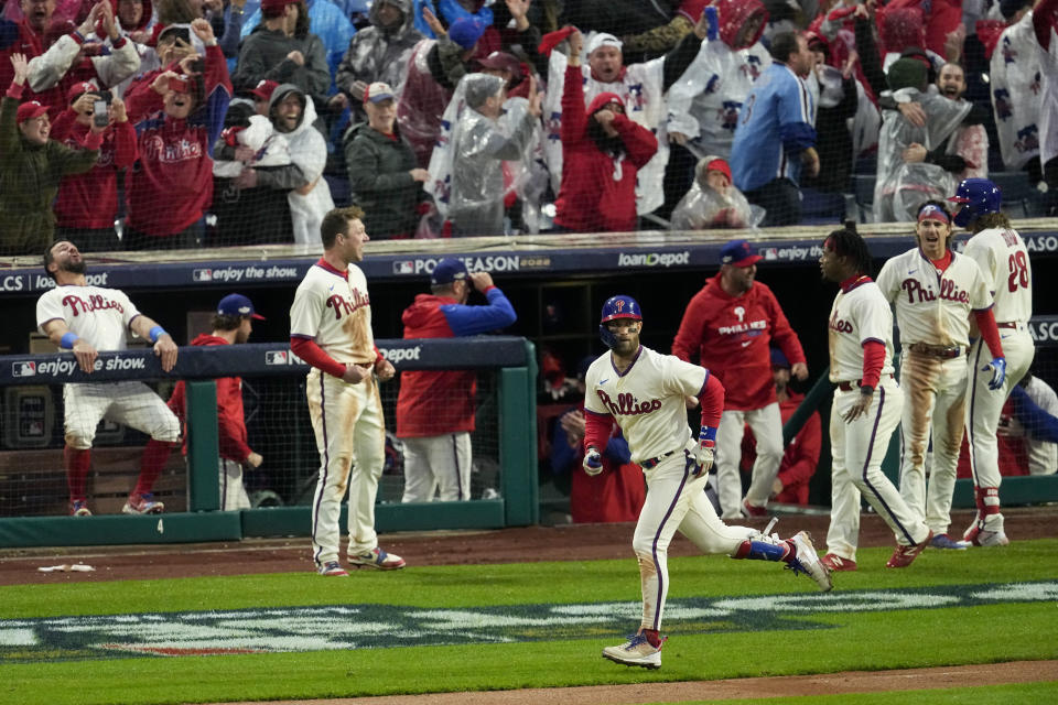 Philadelphia Phillies' Bryce Harper rounds the bases after a two-run home run during the eighth inning in Game 5 of the baseball NL Championship Series between the San Diego Padres and the Philadelphia Phillies on Sunday, Oct. 23, 2022, in Philadelphia. (AP Photo/Matt Rourke)