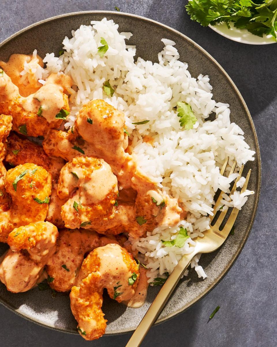 bang bang shrimp in a creamy spicy sauce with chopped cilantro