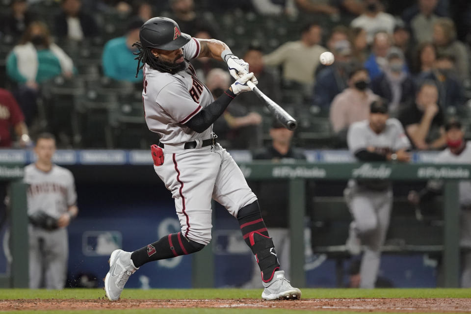 Arizona Diamondbacks' Henry Ramos flies out to end the top of the fourth inning of a baseball game against the Seattle Mariners, Friday, Sept. 10, 2021, in Seattle. (AP Photo/Ted S. Warren)