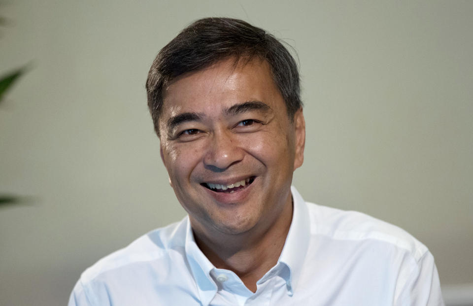 The leader of Thailand's Democrat Party Abhisit Vejjajiva talks to The Associated Press reporters during an interview Wednesday, March 20, 2019. in Bangkok, Thailand. Abhisit says if he becomes prime minister after Sunday’s election, he’ll make careful but forceful efforts to undo undemocratic constitutional clauses imposed by the military government that took power in 2014. (AP Photo/Sakchai Lalit)