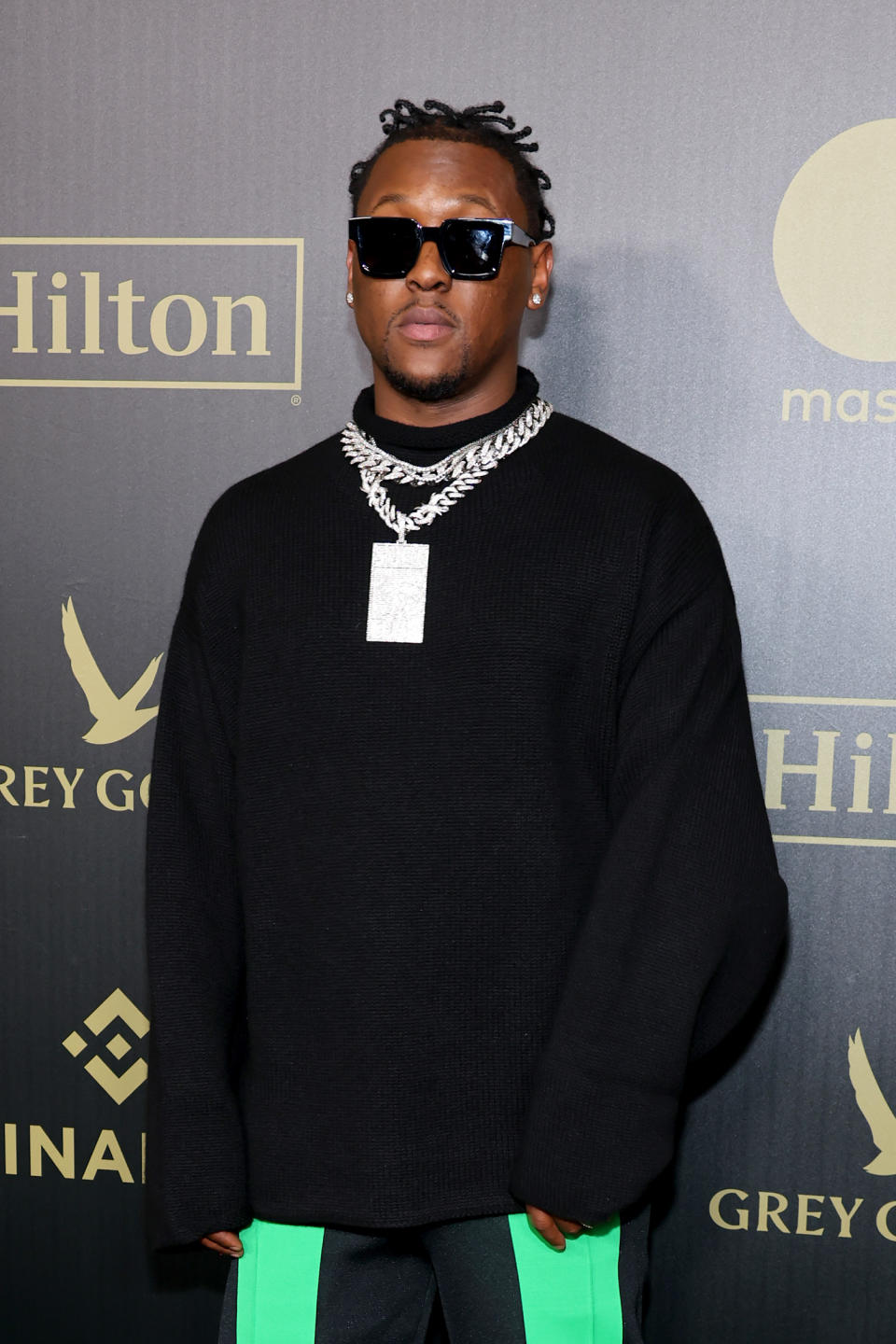 Hit-Boy in black longsleeve and sunglasses