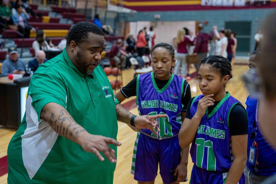 Grace James coach Armond Wilson has led his team to an 11-2 record in the school's first varsity basketball season.