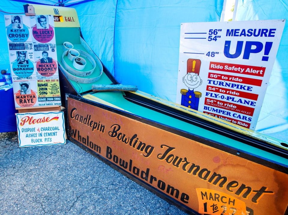 The New Whalom Cooperative’s traveling museum displays a skee ball lane and various signs saved from Whalom Park at the Whalom Weekend carnival Friday.