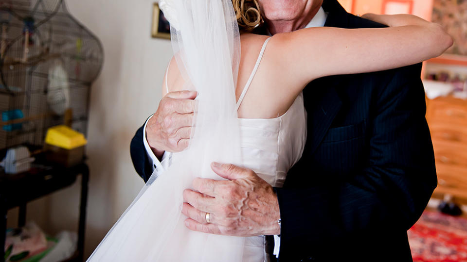 bride and groom hugging