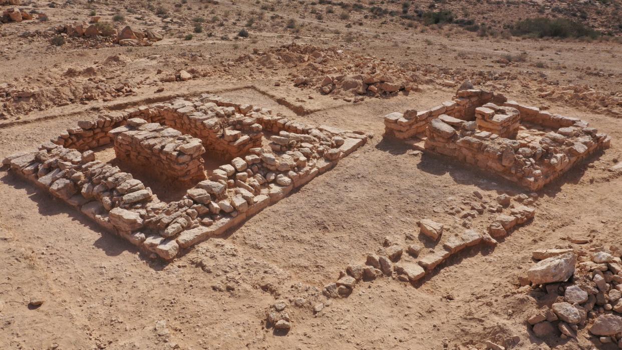  Two square tombs in the desert build with rock bricks 