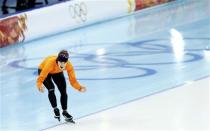 Irene Wust of the Netherlands celebrates after realising she has won the women's 3000 meters speed skating event during the 2014 Sochi Winter Olympics, February 9, 2014. REUTERS/Issei Kato