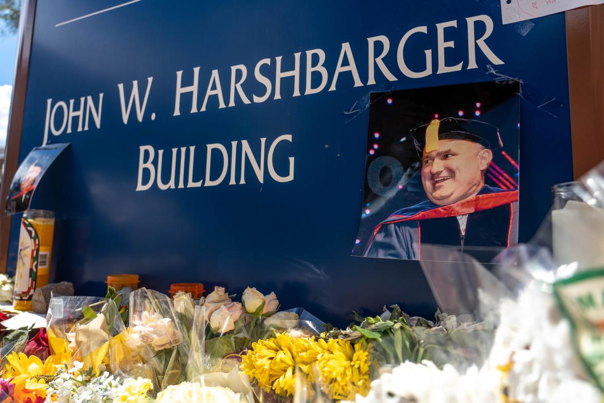 Flowers decorate a memorial for Dr. Thomas Meixner, professor and head of the Department of Hydrology and Atmospheric Sciences at the University of Arizona, in Tucson on Oct. 8, 2022. Meixner was fatally shot on campus Oct. 5.