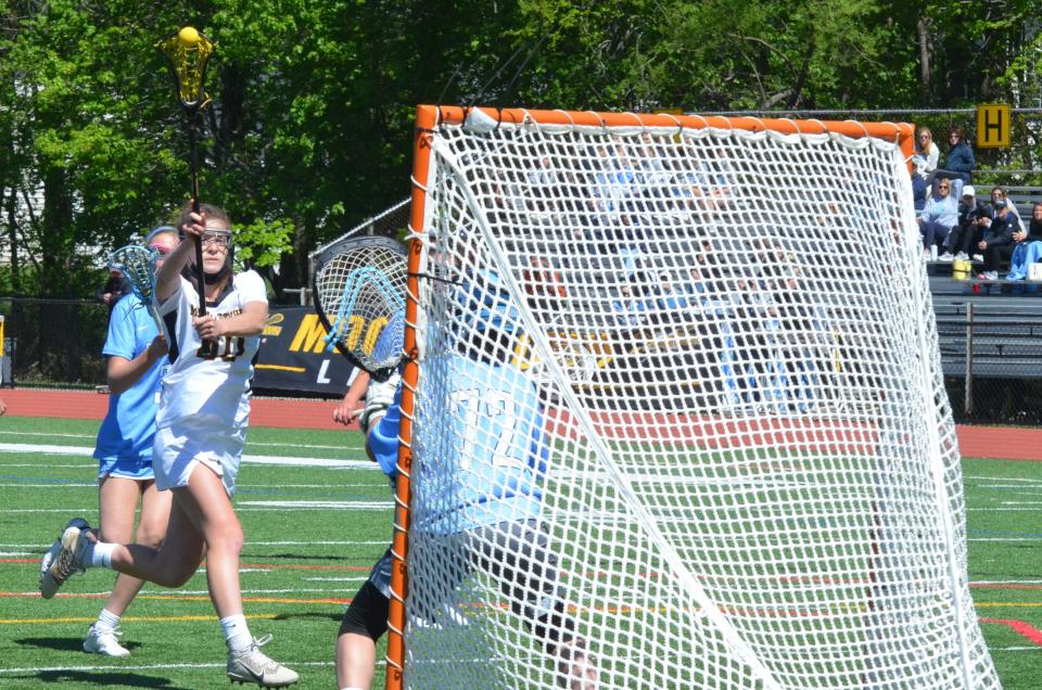 Moorestown junior Katie Buck scores a goal against Shawnee