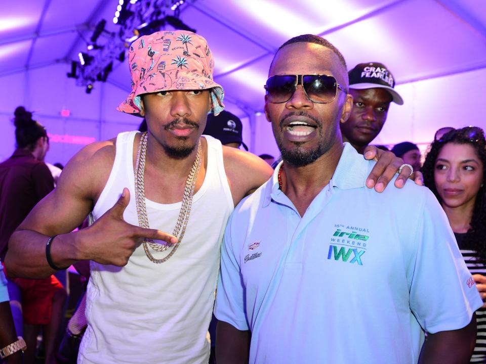 Nick Cannon and Jamie Foxx at the Celebrity Golf Tournament during DJ Irie Weekend at Miami Beach Golf Club on June 20, 2014 in Miami Beach, Florida