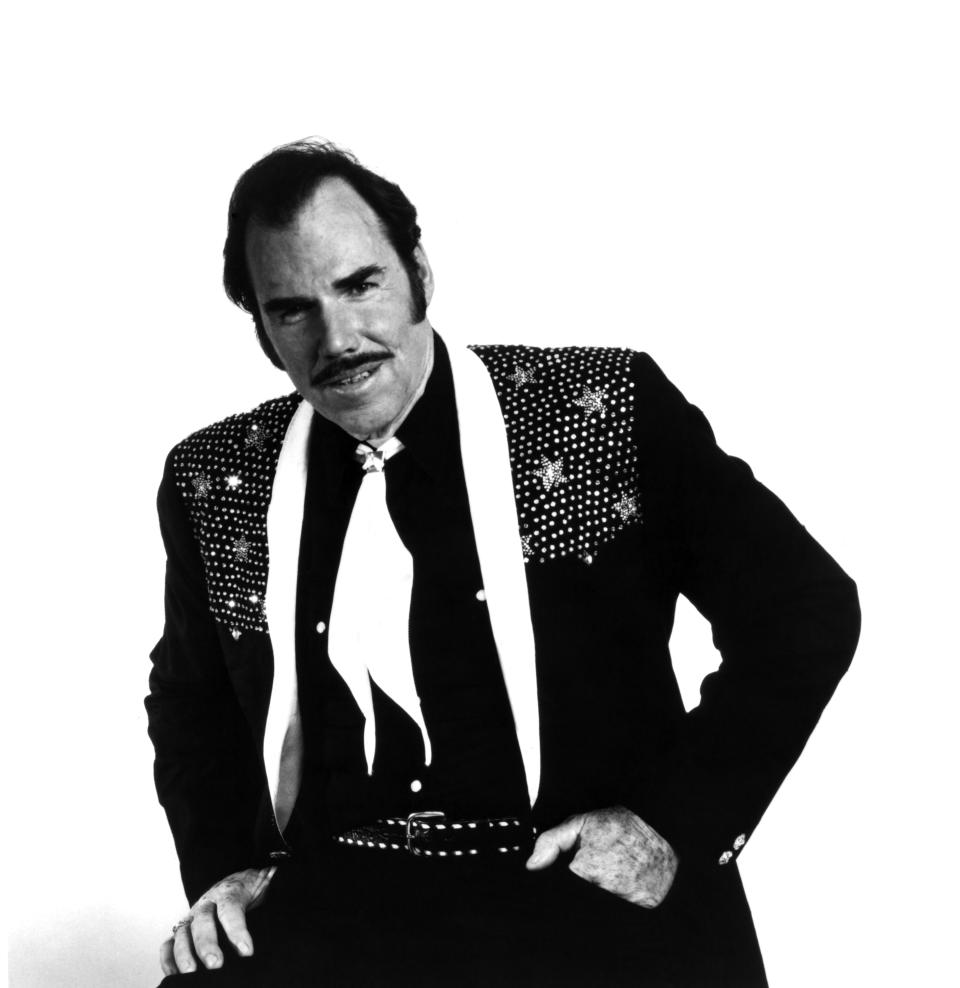 FILE - This 1980 file photo originally provided by Epic Records shows country singer Slim Whitman. Whitman died Wednesday, June 19, 2013 of heart failure in Florida. He was 90. Whitman's career began in the late 1940s, and his tenor falsetto and ebony mustache and sideburns became global trademarks. They were also an inspiration for countless jokes thanks to the ubiquitous 1980s and 1990s TV commercials that pitched his records. (AP Photo/Epic Records, file)