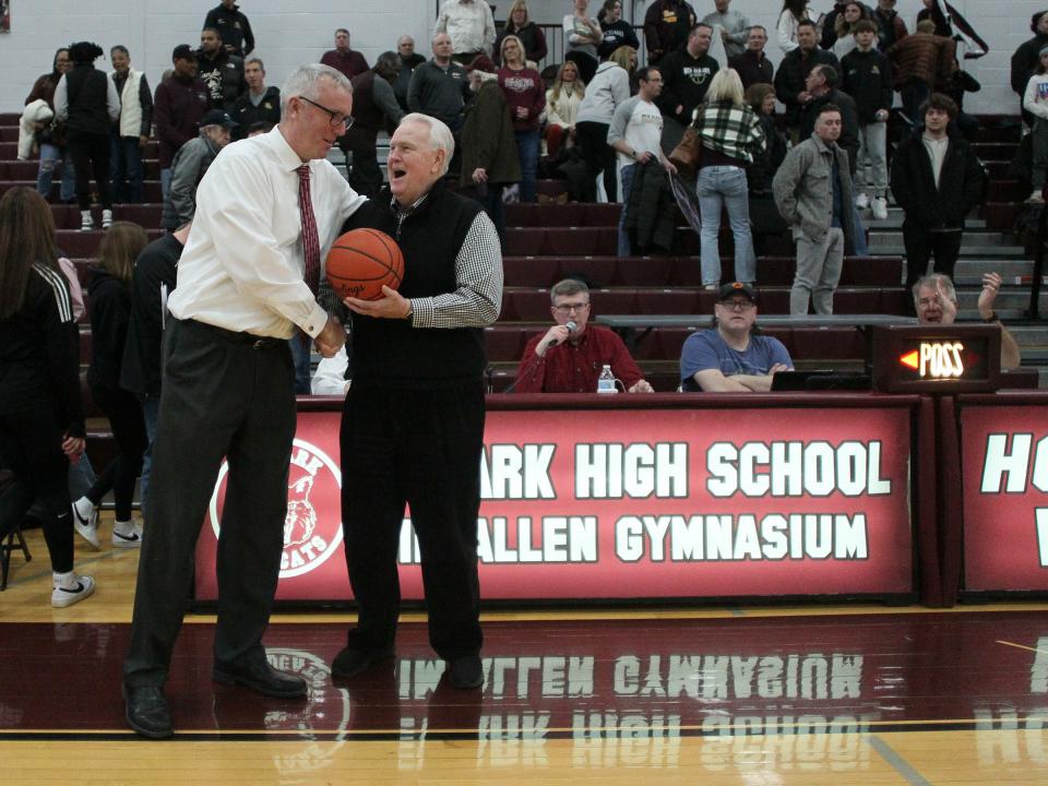 Gary Walters congratulates coach Jeff Quackenbush after Quackenbush, his former player, passed him as the Wildcats' all-time leader with 408 wins thanks to a 58-36 victory against New Albany at Jimmy Allen Gymnasium on Friday, Feb. 24, 2023. Newark advanced to play Gahanna in Wednesday's Division I district semifinals.