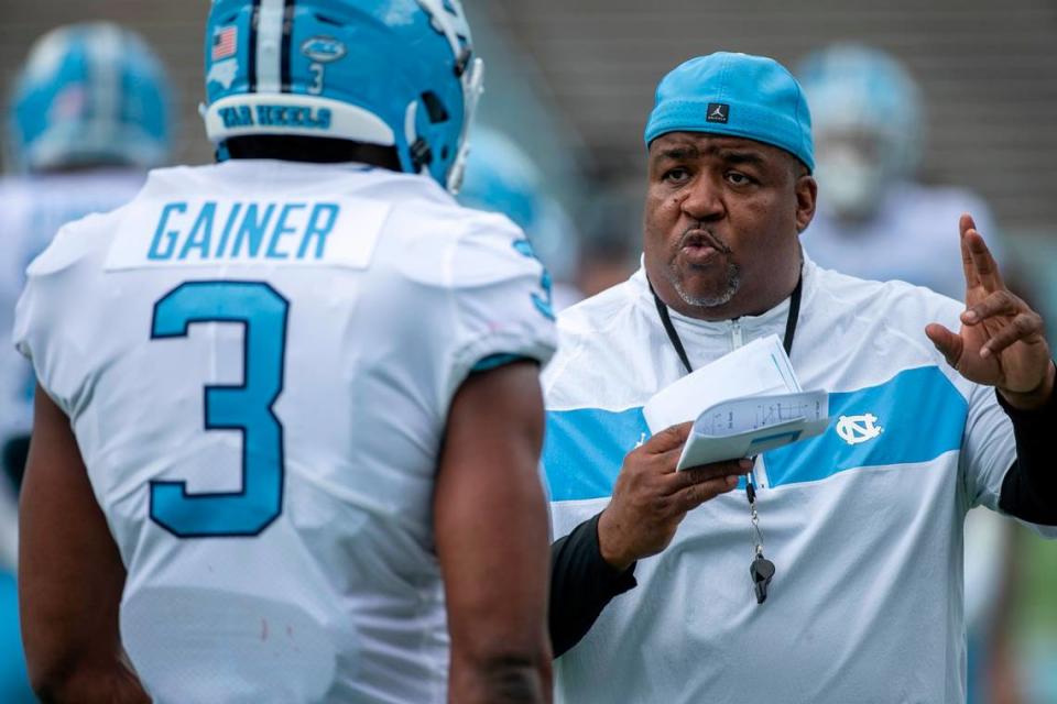 North Carolina defensive line coach Tim Cross works with Amari Gainer (3) prior to the Tar Heels’ spring football game on Saturday, April 15, 2023 at Kenan Stadium in Chapel Hill, N.C.