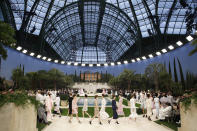 Models wear creations for the Chanel Spring/Summer 2019 Haute Couture fashion collection presented in Paris, Tuesday Jan. 22, 2019. (AP Photo/Christophe Ena)