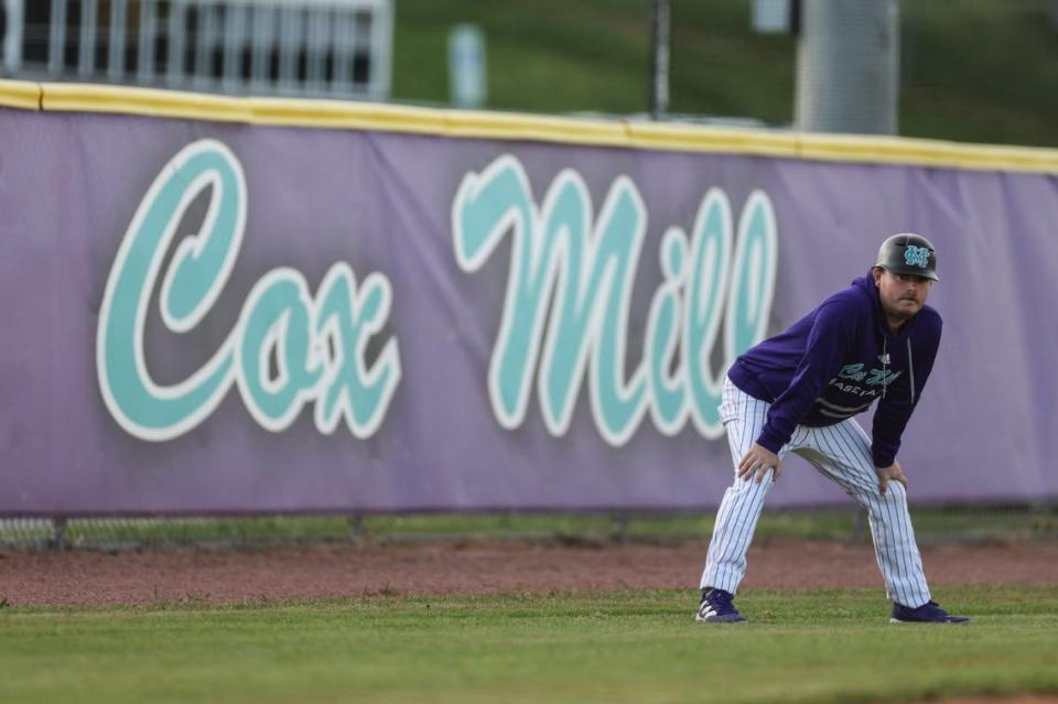 Cox Mill Chargers coach Grayson Butler coaches at Cox Mill High School in Concord, N.C., on Friday, April 12, 2024.